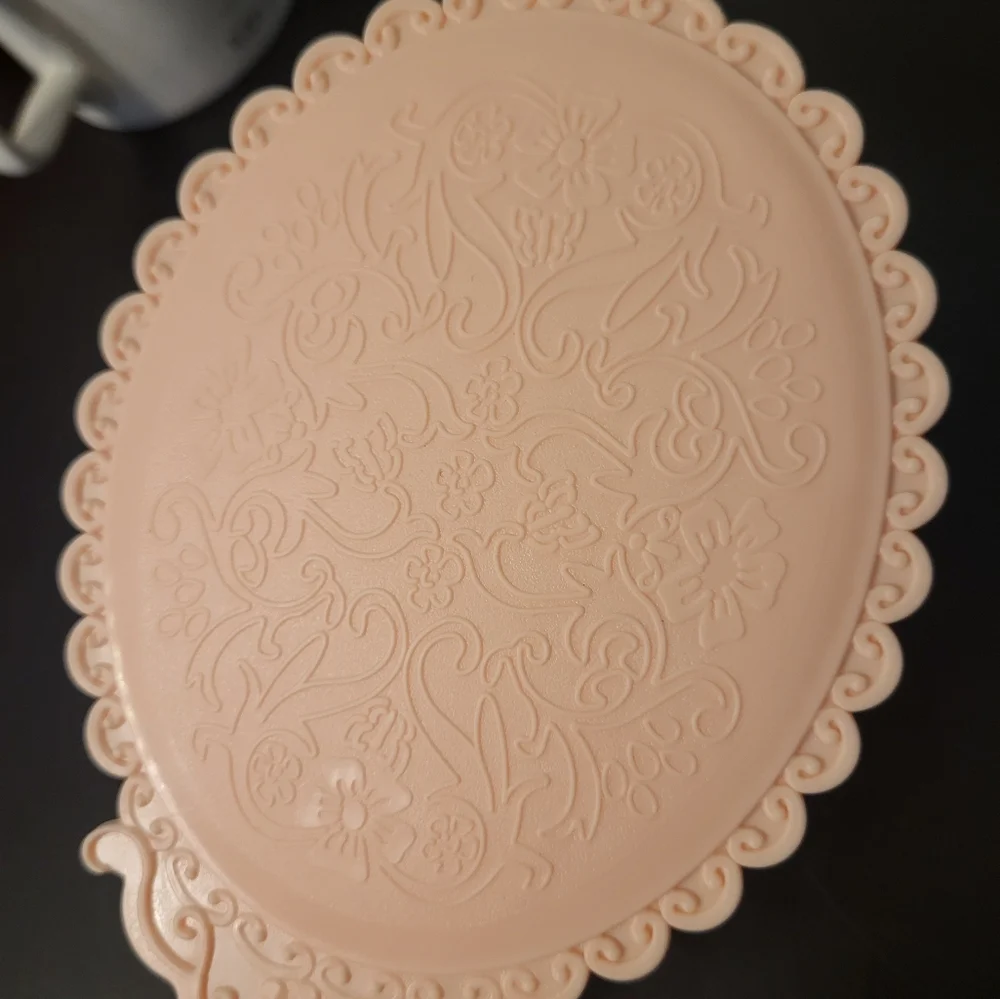 Pink plastic fantasy hand mirror